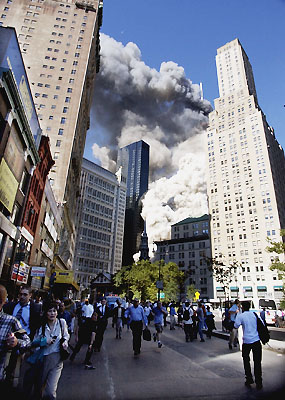 9/11: People flee uptown as debris clouds sweep across Lower Manhattan.