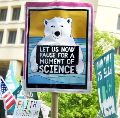 Climate March WashDC sign: Let Us Now Pause For A Moment Of Science