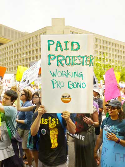 Climate March Washington Sign-Paid Protester Working Pro Bono