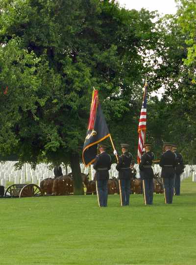 Honor Guard stands at attention while casket is loaded on caission at Arlington Cemetery