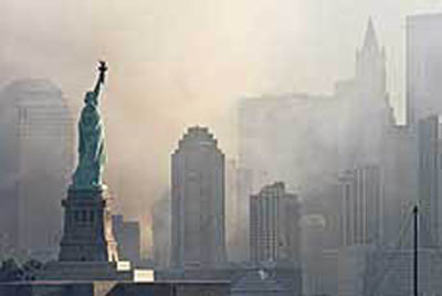 911 Statue of Liberty in a dusty New York City skyline the morning after the attacks