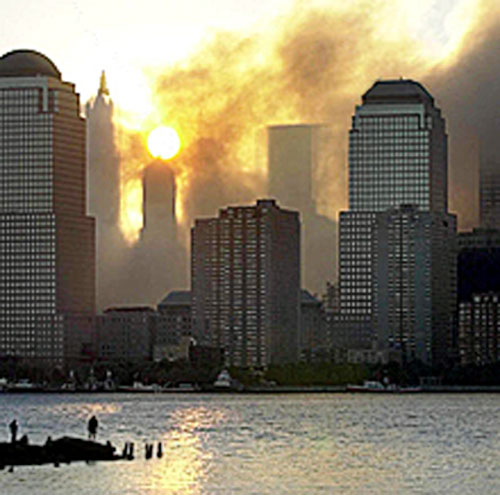 911 - The first sunrise over the New York City skyline after the terrorist attacks of 11 September 2001.