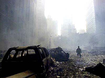 911 WTC - Gutted cars, rubble-strewn streets.