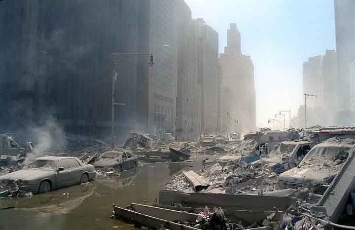 911 New York: Rubble, Water and CarsBelow the South Tower. Looking down WestSt at the corner with Liberty St.