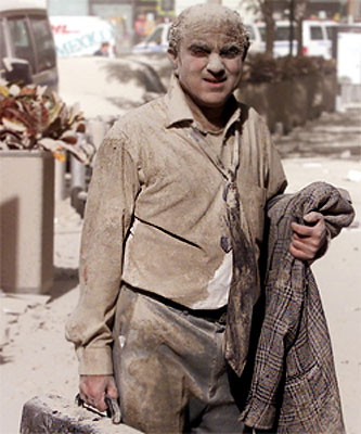 Covered in ash, office worker trudges updown from the WTC disaster