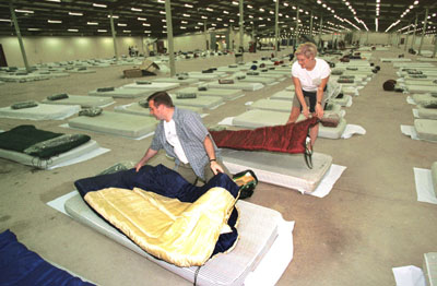 Photo: Tim Krochak - AP. 911 - US close airspace - stranded int'l travelers bed down in Halifax, NS, Canada at Exhibition Park 9000