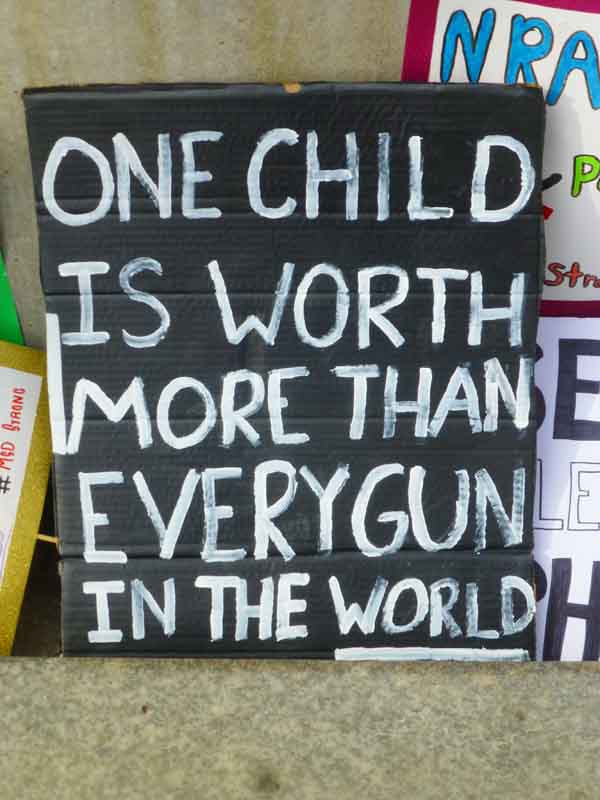 2018 Gun March sign - one child is worth more than all the guns